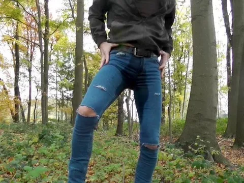 wetting my destroyed jeans in the forest